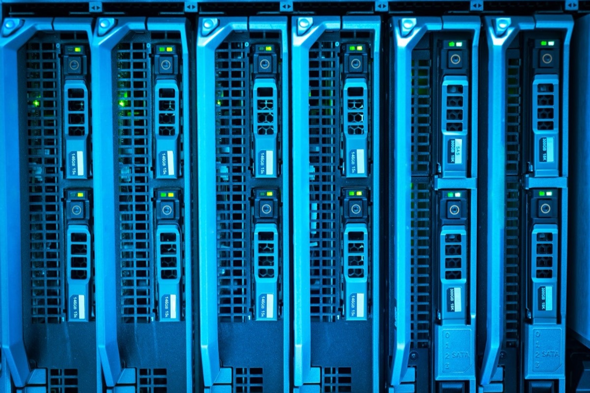 Close-up of illuminated servers in a data center