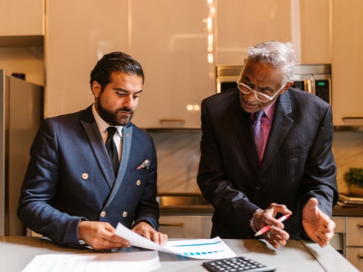 A financial advisor reviewing documents with a client
